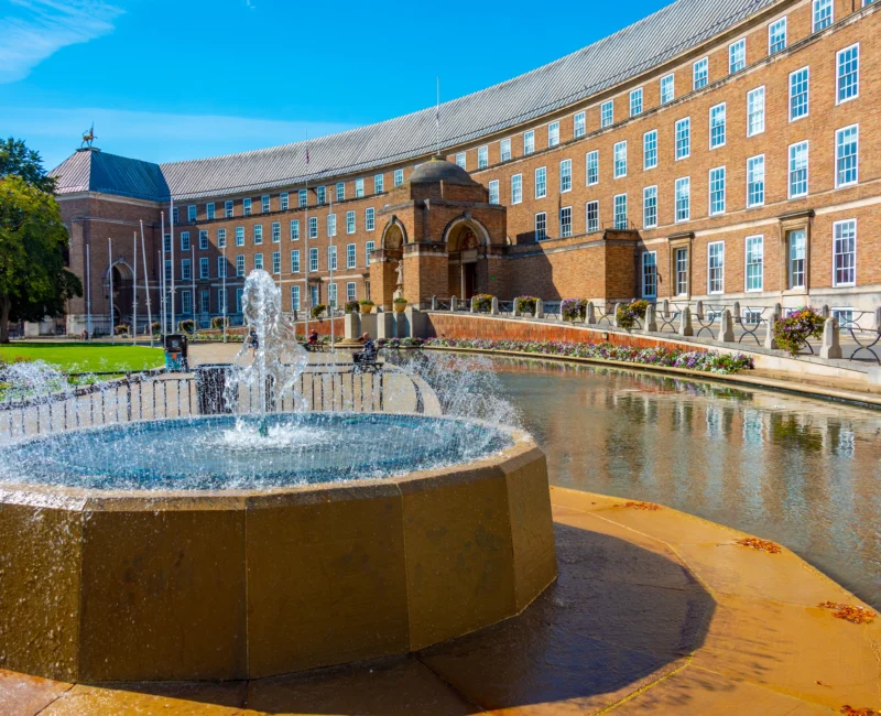 Bristol City Council building with fountain and reflecting pool.